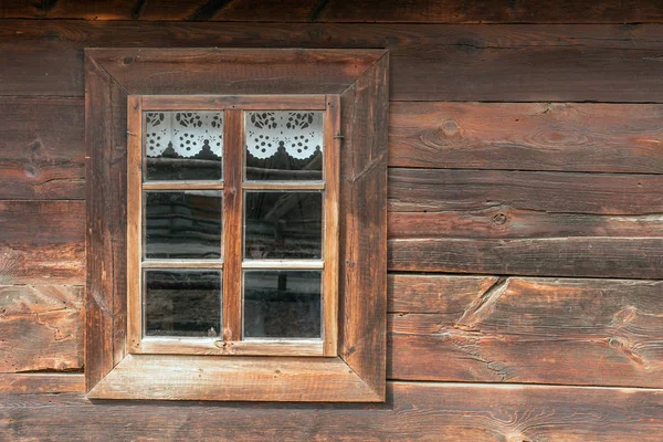 The old window of old wooden house. Background of wooden walls Royalty Free Stock Images