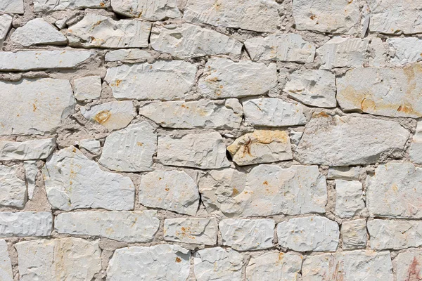 Muro di pietra per l'uso come sfondo — Foto Stock