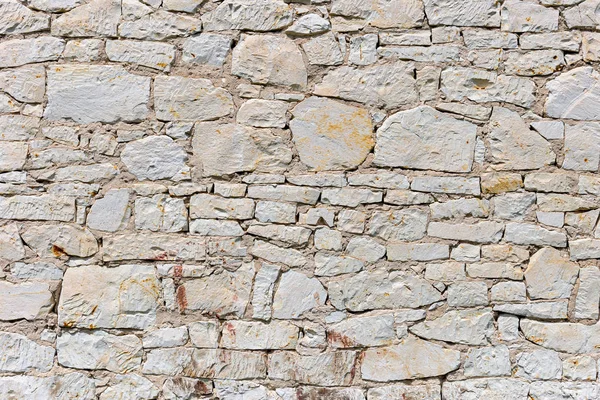 Muro di pietra per l'uso come sfondo — Foto Stock