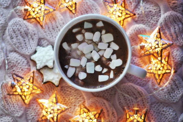 hot cocoa with marshmallows with lights and cookies