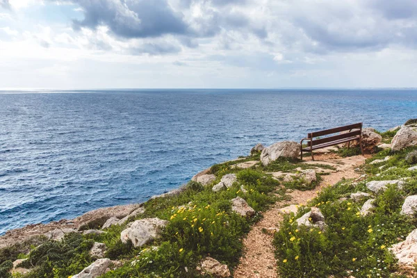 stock image Bench stands on the seashore. Beautiful valley by the sea. Seascape in Cyprus Ayia Napa