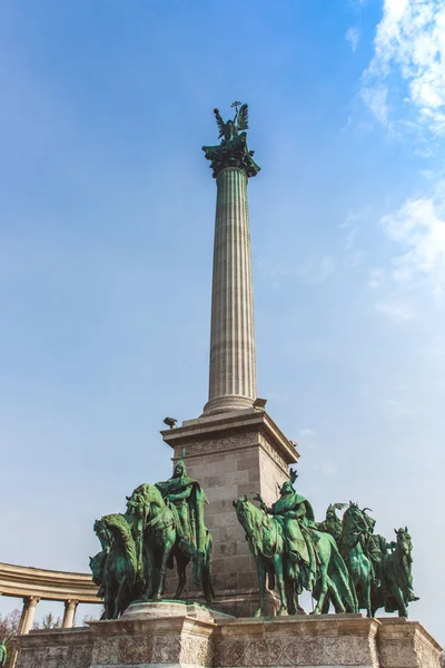 Millennium Monument on the Heroes Square. Blurred-unrecognizable faces of people. Is one of the most-visited attractions in Budapest squares in Budapest, Hungary.