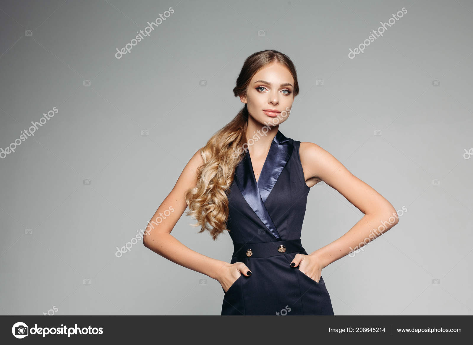 Beautiful lady with blonde hair in tail wearing office dress with hands in pockets. Stock Photo by ©studioluckyaa 208645214 Beautiful lady with blonde hair in tail wearing office dress with hands in pockets. Stock Photo by ©studioluckyaa 208645214