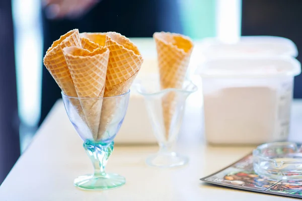 Empty waffle cone in glass for ice cream.