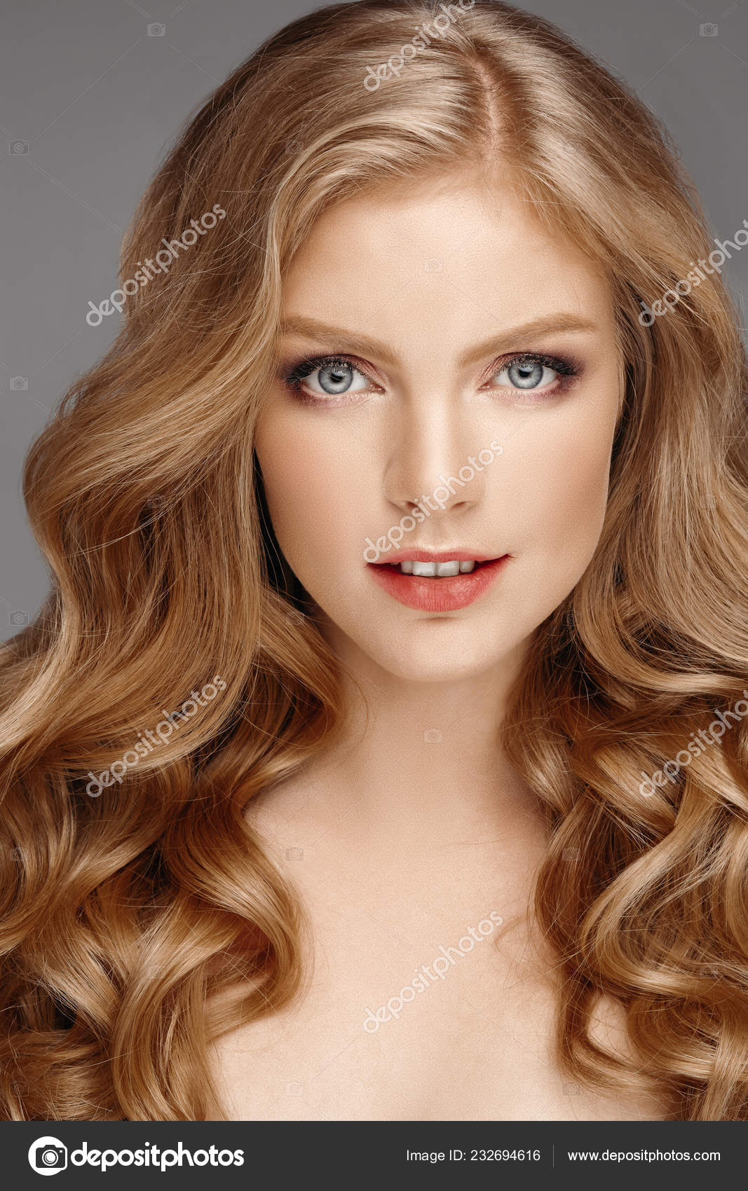 Stunning natural beauty with blonde wavy hair. Stock Photo by  ©studioluckyaa 232694616