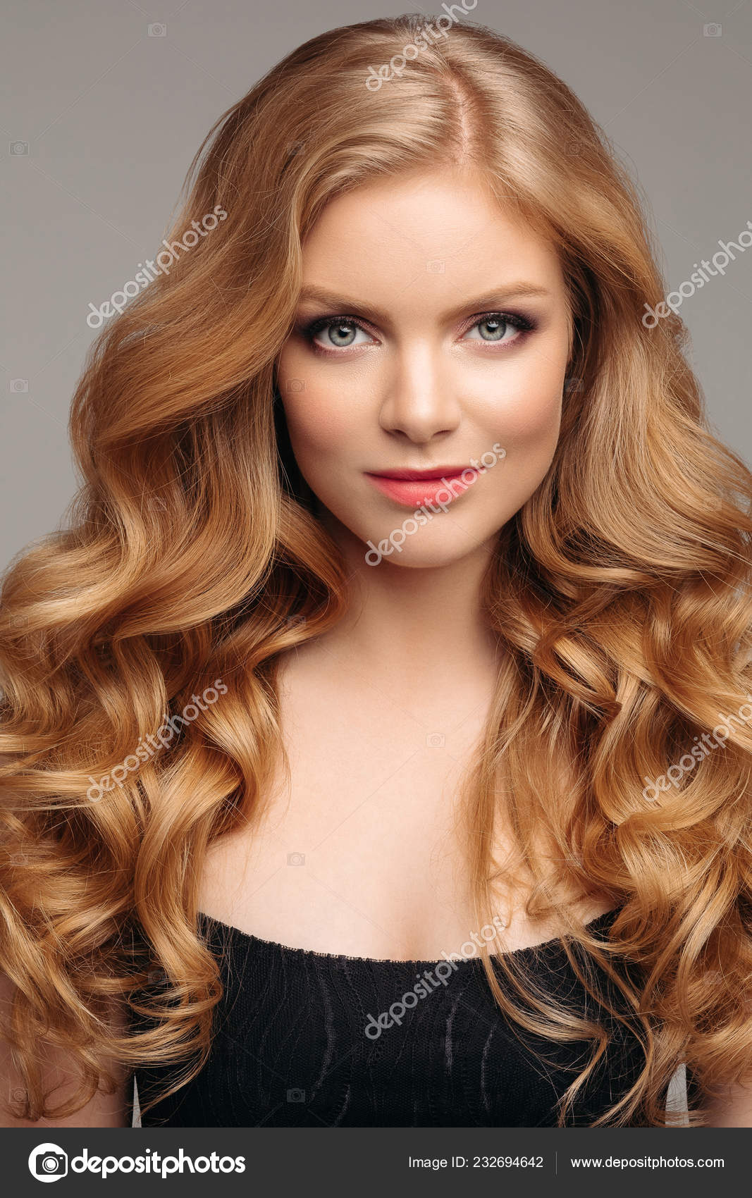Stunning natural beauty with blonde wavy hair. Stock Photo by  ©studioluckyaa 232694642