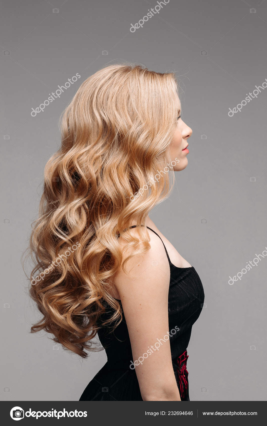 Stunning woman with perfect wavy blonde hair. Stock Photo by ©studioluckyaa  232694646