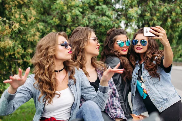 Fashionable ladies with hairstyle taking selfie outdoors. — Stock Photo, Image