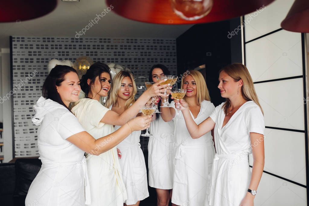 Beautiful and positive bide mades having fun on hen party.