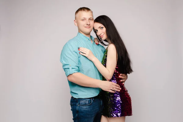 Beautiful young pair embracing each other in studio — Stock Photo, Image