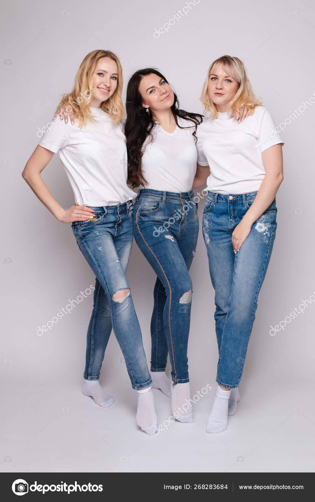 Three Beautiful Women In White Shirts And Jeans Posing Stock Photo By C Studioluckyaa