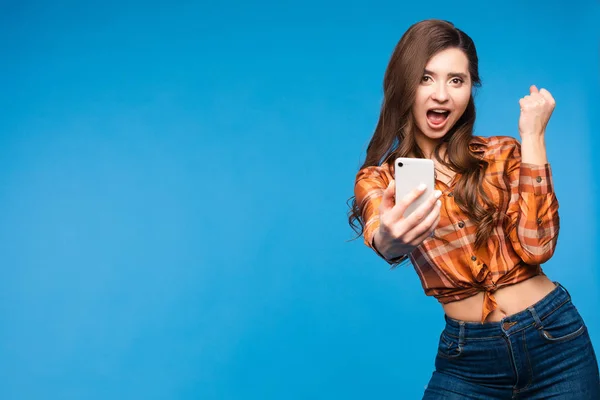 Lucky girl in checkered shirt taking selfie and smiling — Stock Photo, Image