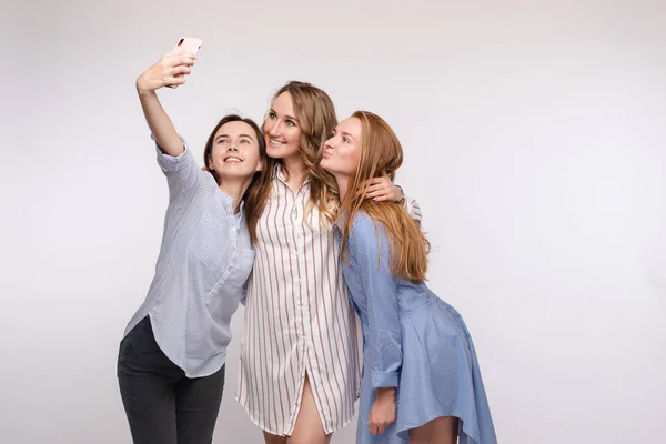 Gorgeous slim friends taking selfie via mobile. — Stock Photo, Image