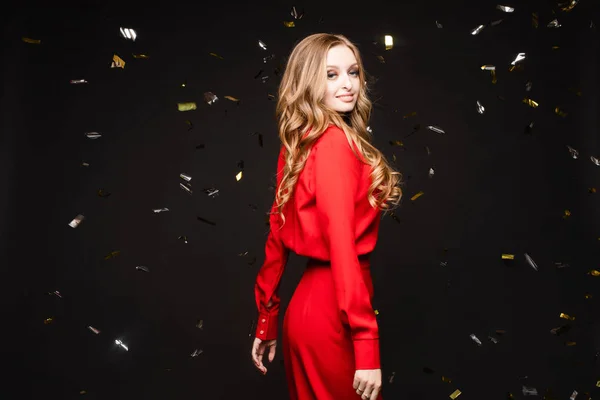 Elegant woman in long black dress posing in studio — Stock Photo, Image