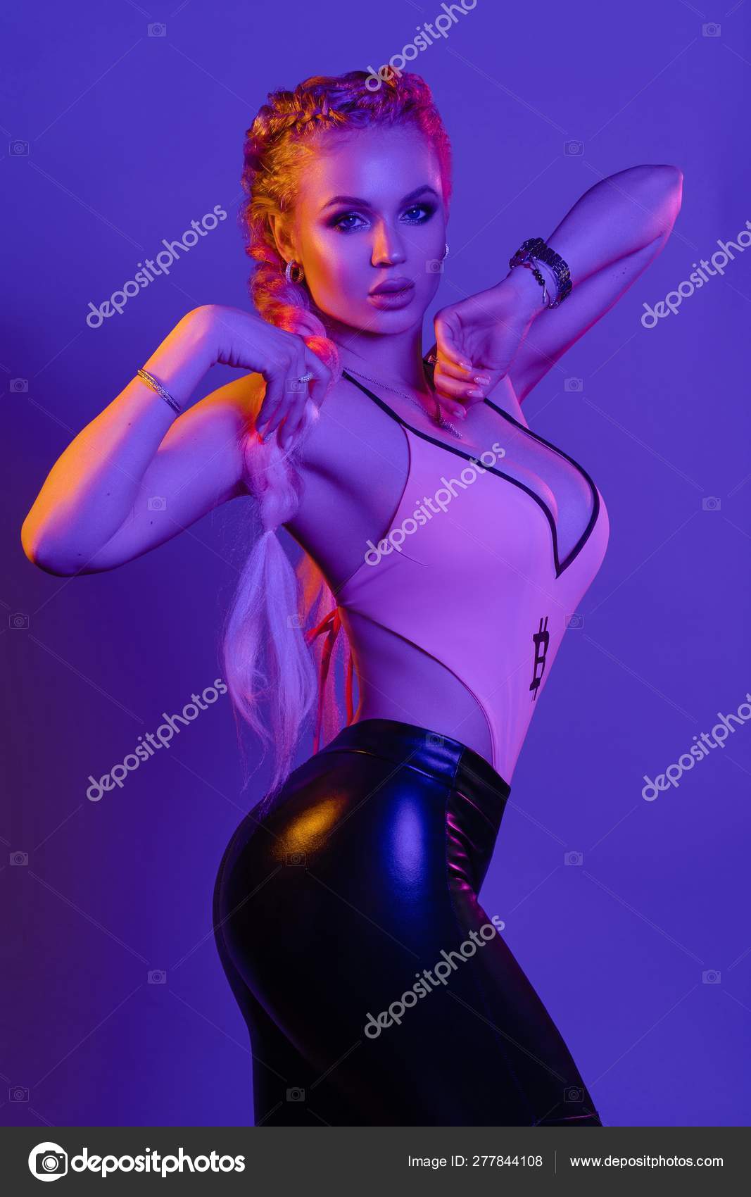 Sexy hot blonde in leggings and top posing Stock Photo by ©studioluckyaa  277844108