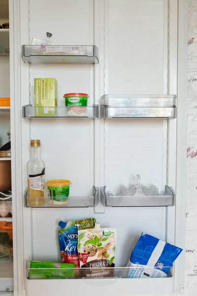 Belarus Minsk 06 12 2019 Front view of refrigerator full of food staying at home — Stock Photo, Image