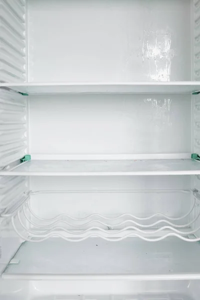 Front view of empty refrigerator staying at home