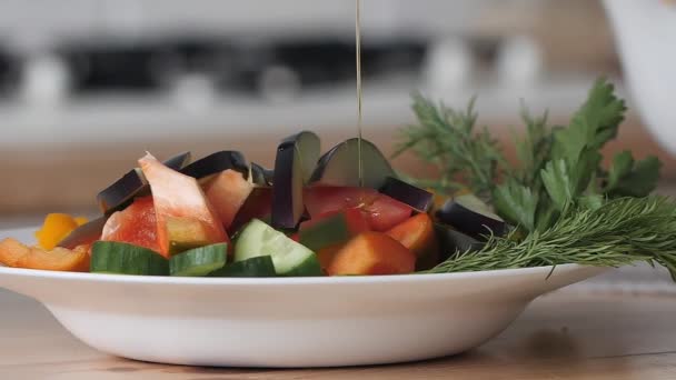 Olive oil pouring over mixed salad.olive oil pouring over mixed salad. — Stock Video