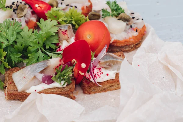 Appetizing sandwich with bacon decorating greenery serving on plate ready for eating close-up — Stock Photo, Image