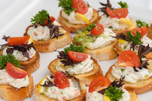 Closeup of delicious canape served on white plate — Stock Photo, Image