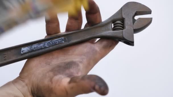 Worker with dirty hands, holding wrench and collecting his payment.  Earning money for services concept. shot — Stock Video