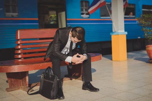 Young asian businessman feel stressed/worry/headache/disappoint during working