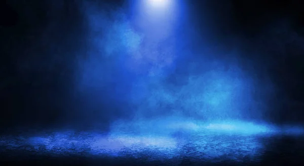 Blue misty dark background. Dark street with smoke, fog, blue spotlights, neon. Dark abstract empty background.