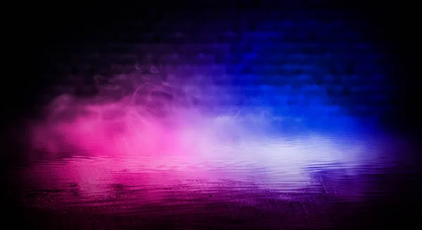 Dark street, room, wet asphalt, puddles, neon light. Reflection of neon light in the water. Night view of the dramatic city, smoke, smog, fog, shadow. Neon lights of the night city.