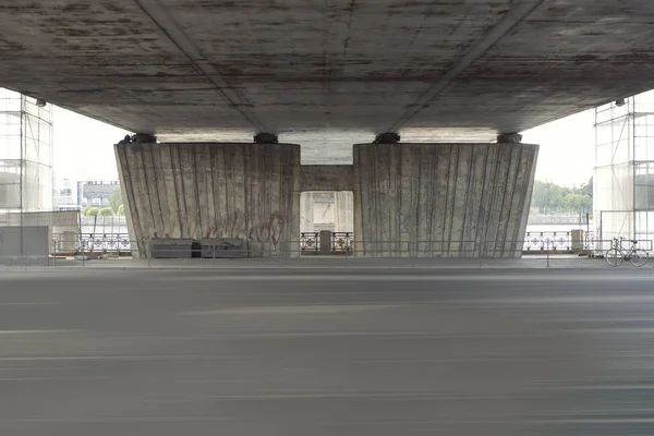 Empty street under a bridge in Riga, Latvia. Reconstruction of the bridge over highway.