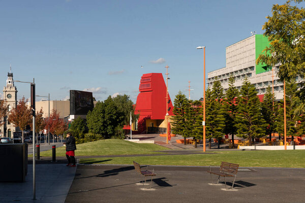 Dandenong city center almost completely deserted during covid-19 lockdown stage 4 restrictions with lonely women walking through the streets.