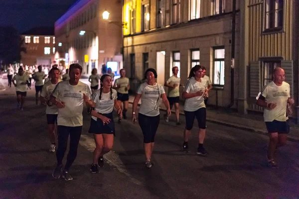 Stokholm, İsveç, 18 Ağustos, 2018: Merkezi Stockholm, Güney bölgelerinde sokaklarında koşmak gece yarısı da Midnattsloppet denir.