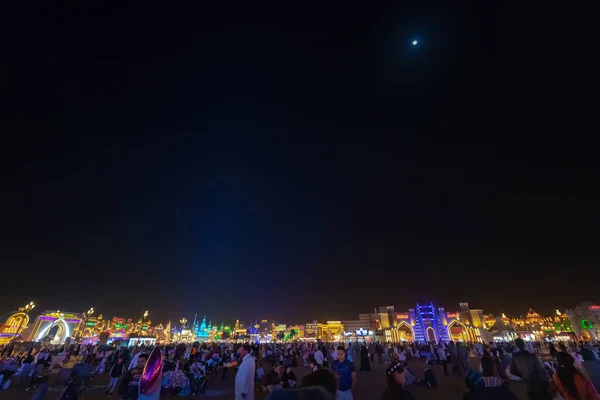 The colorful skyline of Global Village during night with the moo — Stock Photo, Image