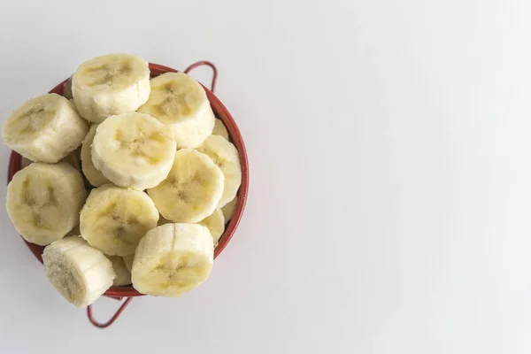 Red Bowl Banana Slices White Background — Stock Photo, Image