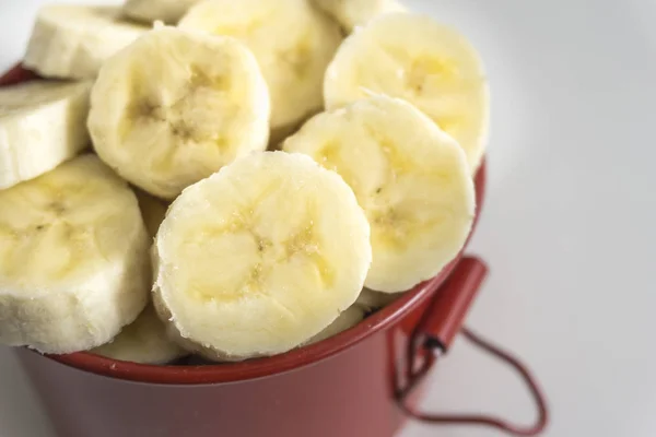 Red Bowl Banana Slices White Background — Stock Photo, Image