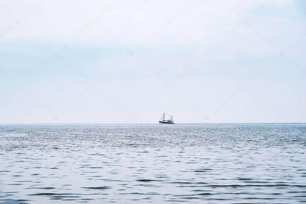 distant shrimp boat on the north sea