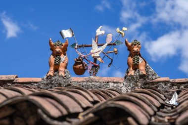 Toritos de Pucara - Peruvian symbol on the house rooftop clipart