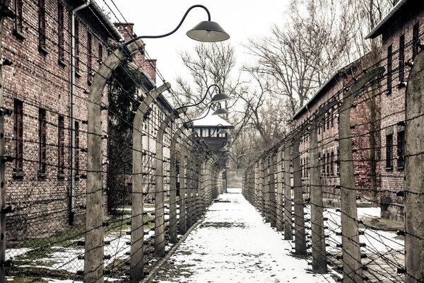 Auschwitz / Oswiecim / Poland - 02.15.2018: Barbed wire fence around a concentration camp. 