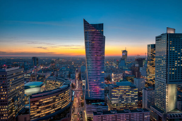 Warsaw cityscape. Panoramic view on the city buildings at sunset in the capital of Poland.