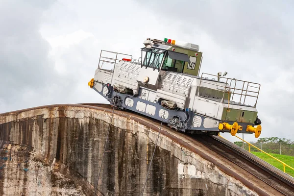 View on the pulling cart, electric locomotive on the rails in the Panama Canal. It is use to pull the ships through the canals.
