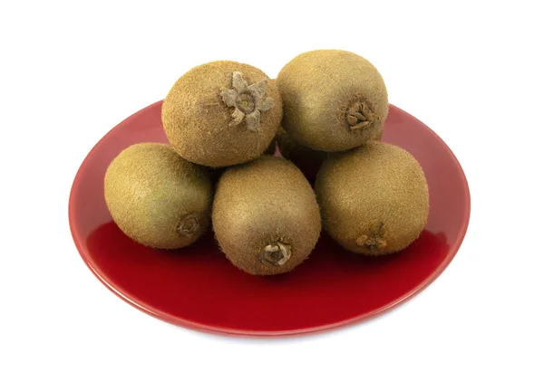 Whole Kiwifruits Hairy Skins Piled Red Plate White Background Sepals — Stock Photo, Image