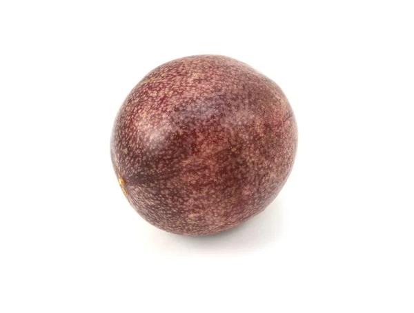 Whole passion fruit with speckled deep purple skin — Stock Photo, Image