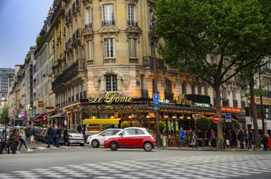 Paris, France - circa May, 2017: The famous restaurant Le Dome on Montparnasse boulevard in Paris. Opened in 1898 it was frequented by famous sculptors, writers and painters clipart