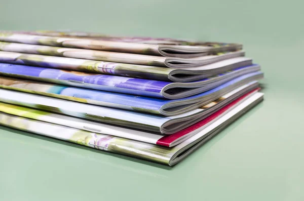 Stack of magazines, brochures, print production background