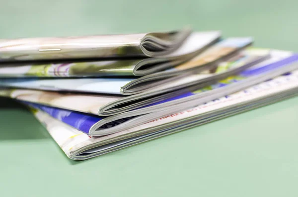 Stack of magazines, brochures, print production background