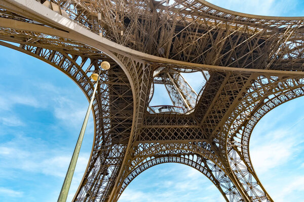 Eiffel tower construction details against blue sky