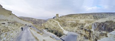 View on Greek Orthodox monastery Great Lavra (monastery) of St. Sabbas the Sanctified (Mar Saba) in Judean desert. Palestine, cca. 2015 clipart