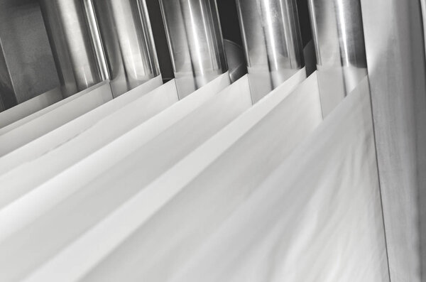 Details of offset printing machine with rollers with paper 