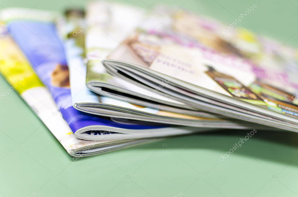 Stack of magazines, brochures, print production background