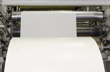 Large paper Roll Print machine in production clipart