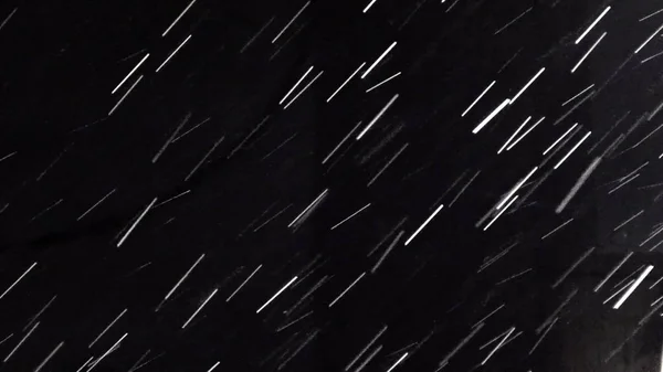 Heavy rain at night. Abstract background loop. It can be used as luma matte for video production